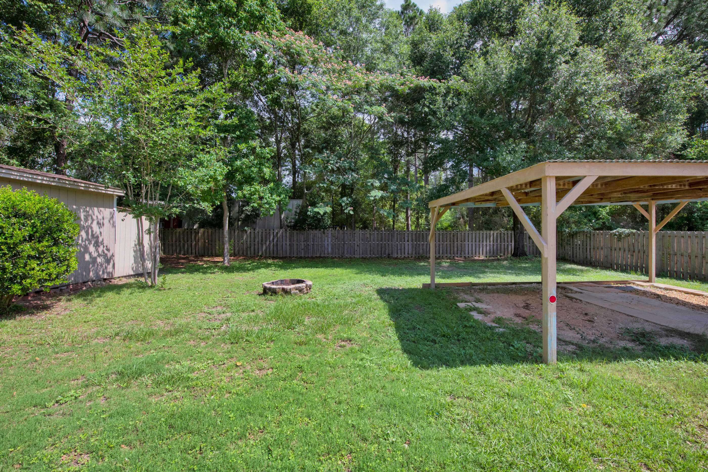 2909 Aplin Road Crestview, FL 32539 - Photo 25 of 29 a view of backyard with small cabin