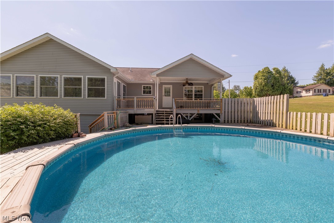 3963 Mark Road Cambridge, OH 43725 - Photo 46 of 50 View of pool with a lawn and a wooden deck