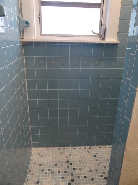 116 145th Avenue Madeira Beach, FL 33708 - Photo 12 of 17 a bathroom with a shower