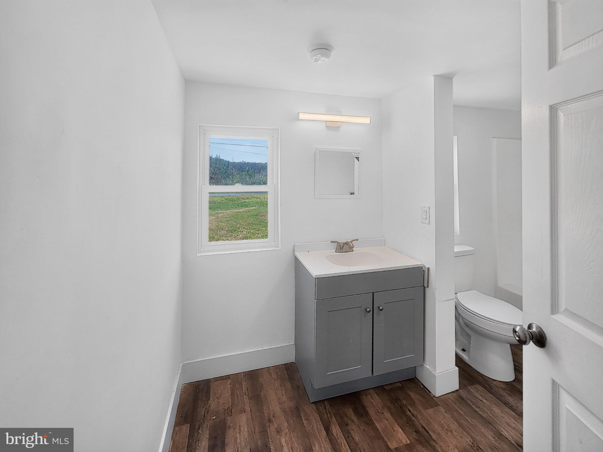 4658 White Marsh Road Madison, MD 21648 - Photo 20 of 25 a bathroom with a sink and toilet