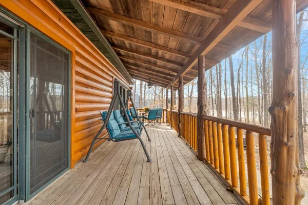 a view of balcony with wooden floor