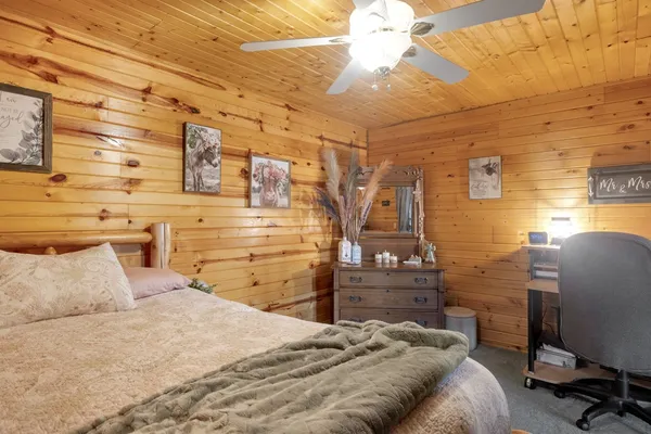 a bedroom with a bed and a chair