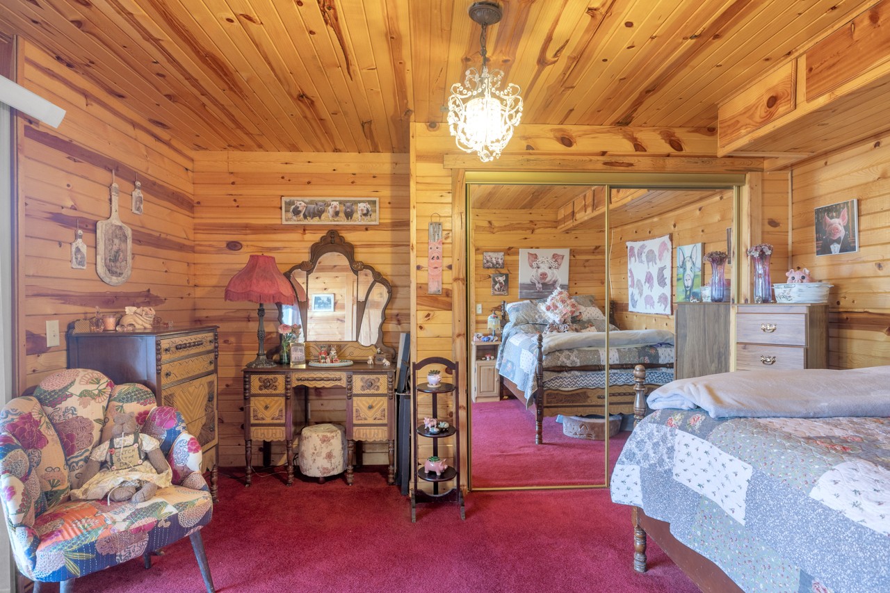 713 Al Henn Road Cadiz, KY 42211 - Photo 25 of 43 a bedroom with furniture and a flat screen tv