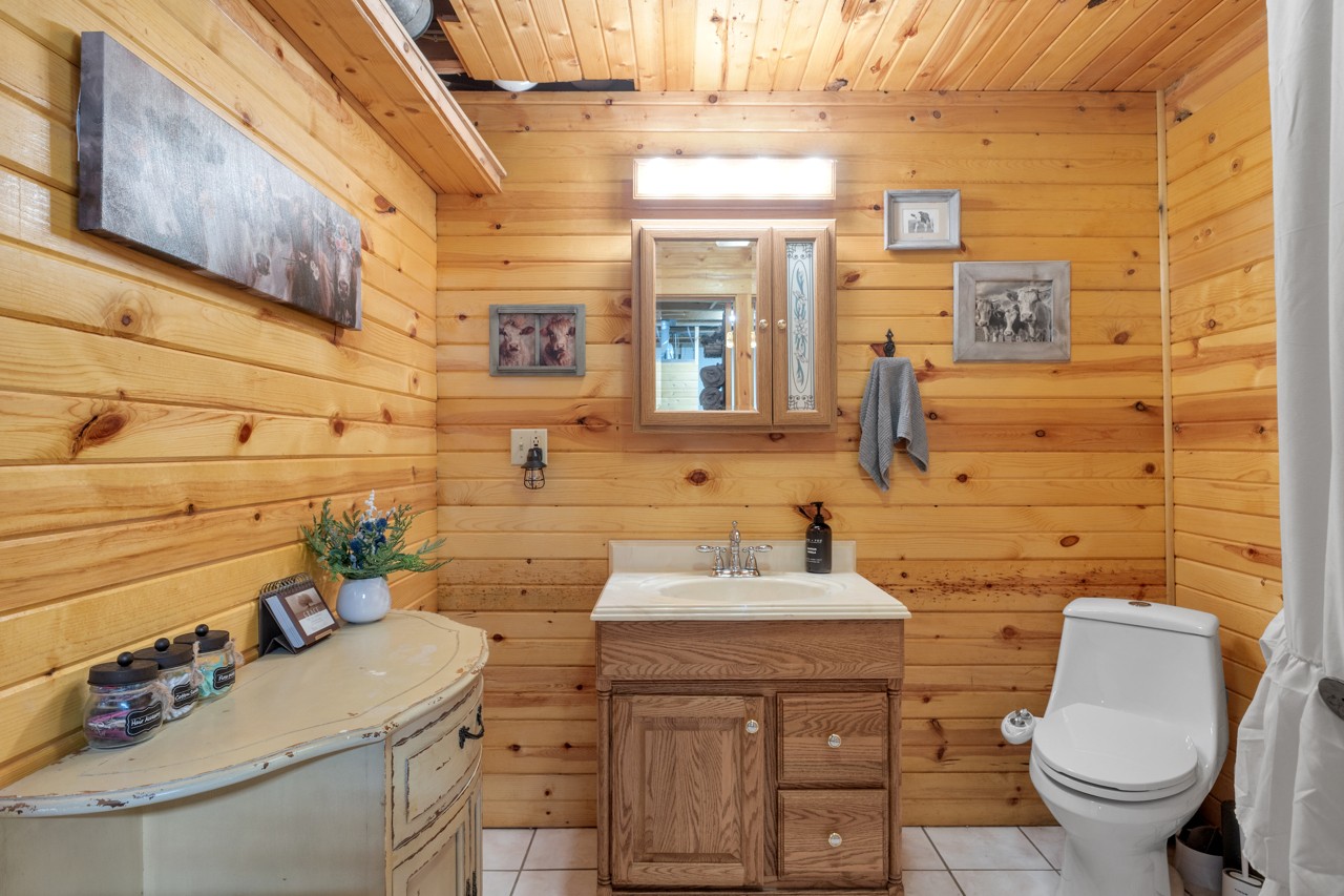 713 Al Henn Road Cadiz, KY 42211 - Photo 28 of 43 a bathroom with a sink toilet and mirror