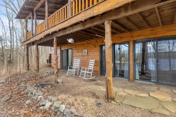 a view of a porch with wooden floor