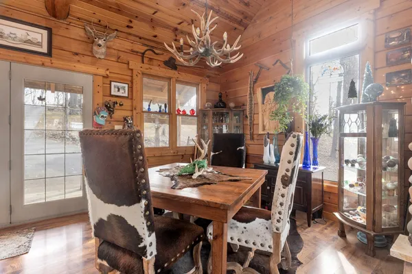 a view of a dining room with furniture window and wooden floor