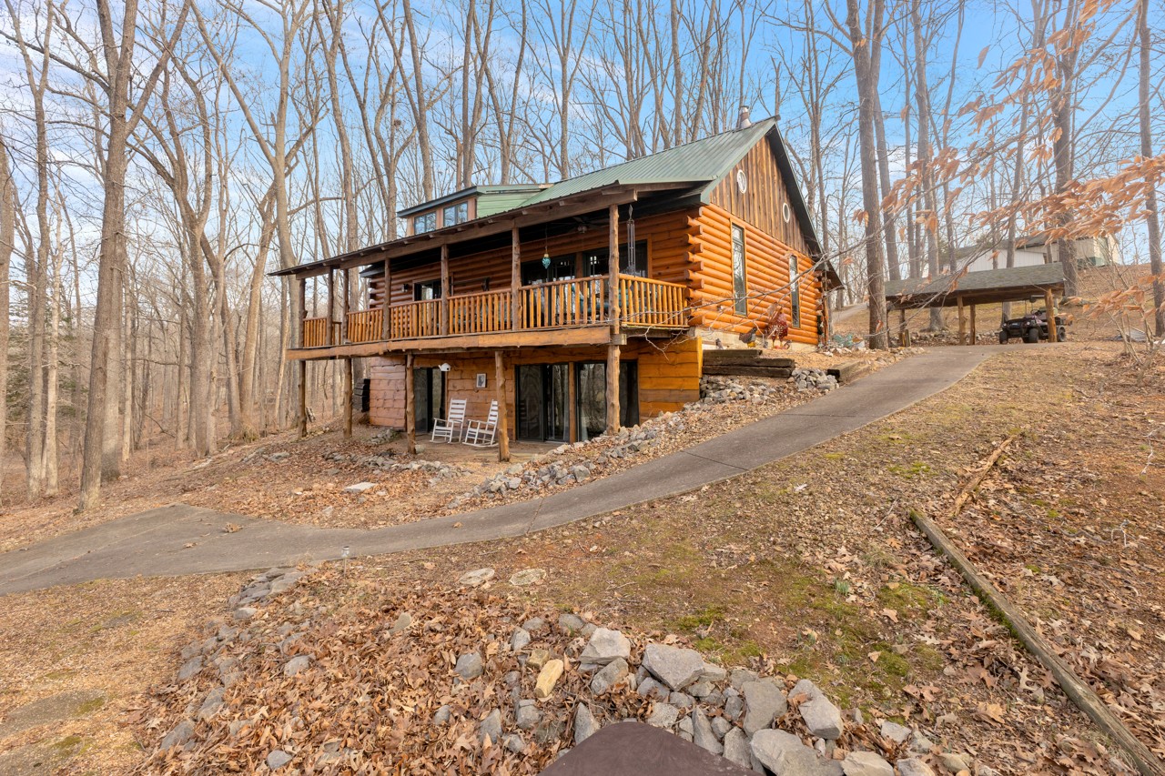 713 Al Henn Road Cadiz, KY 42211 - Photo 31 of 43 a view of a house with a yard covered in snow