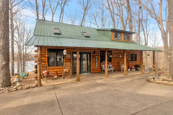 a front view of a building with outdoor seating
