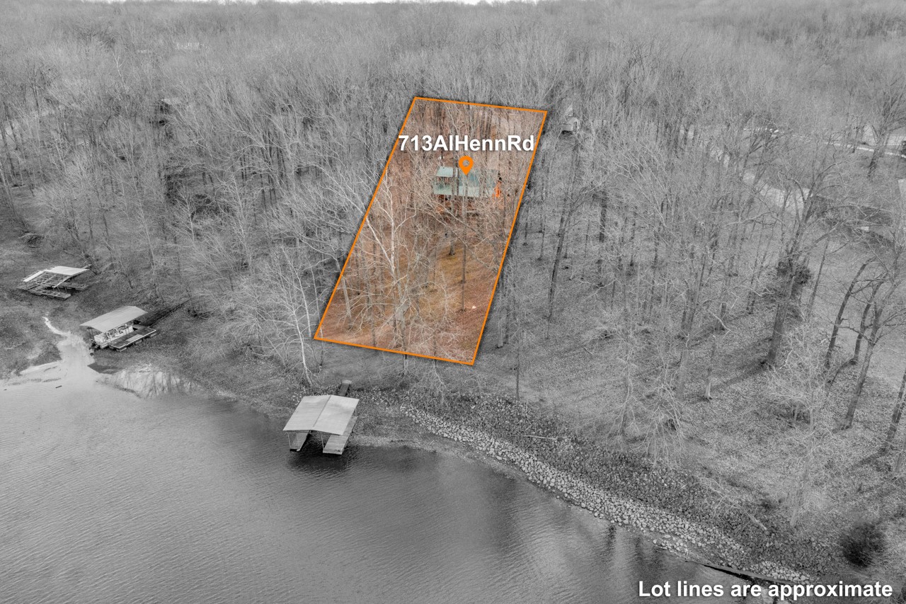 713 Al Henn Road Cadiz, KY 42211 - Photo 37 of 43 a picture of a bathroom with a sink and a mirror