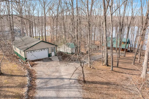 a view of a backyard with a wooden fence