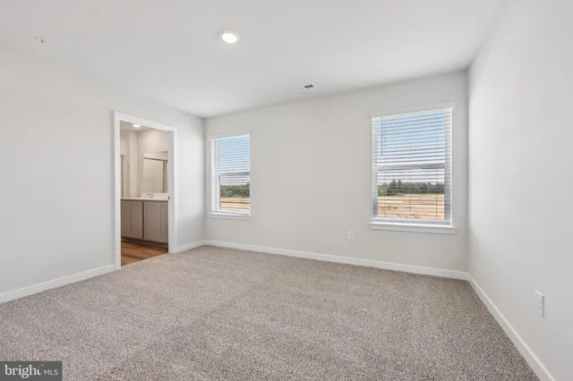 a bathroom with a double vanity sink and mirror