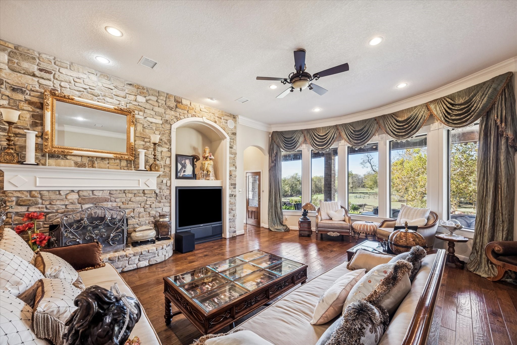 16372 Highway 6 Navasota, TX 77868 - Photo 13 of 49 a living room with furniture fireplace and flat screen tv