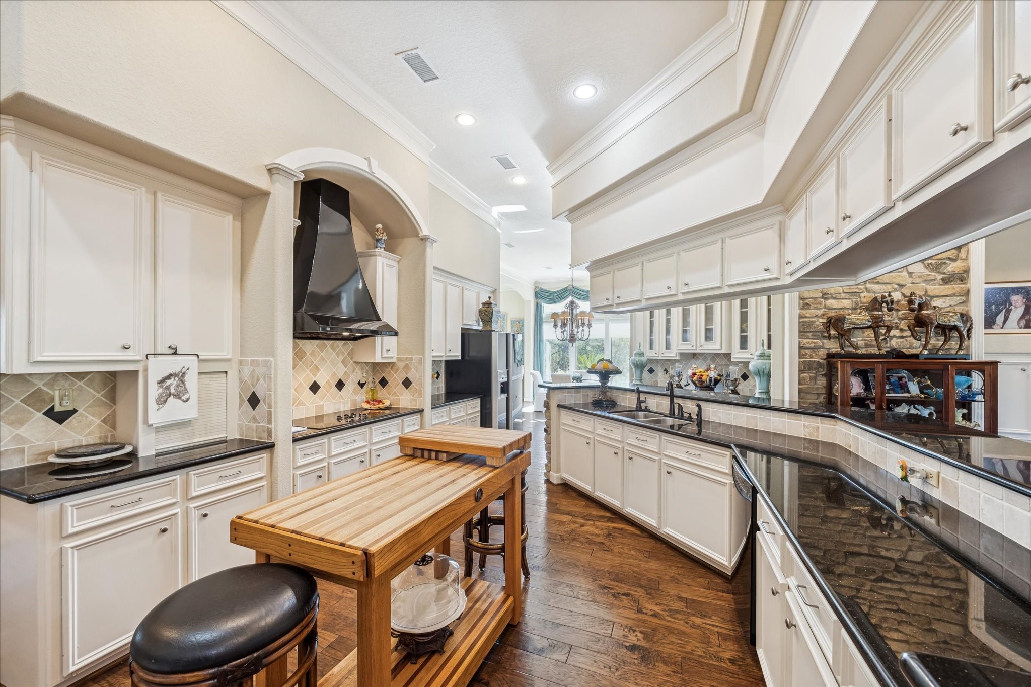 16372 Highway 6 Navasota, TX 77868 - Photo 15 of 49 a kitchen with stainless steel appliances a stove a sink and a refrigerator