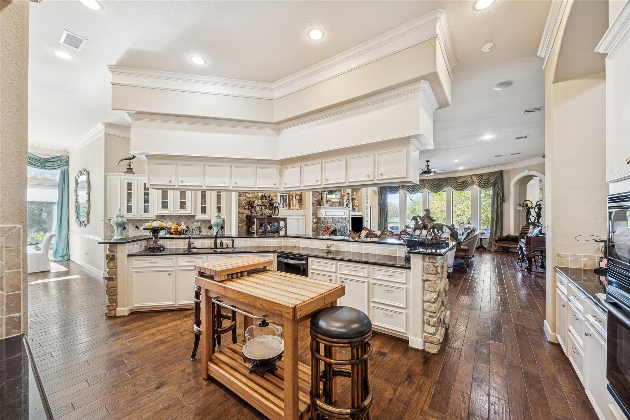 16372 Highway 6 Navasota, TX 77868 - Photo 16 of 49 a kitchen with sink stove and wooden floor