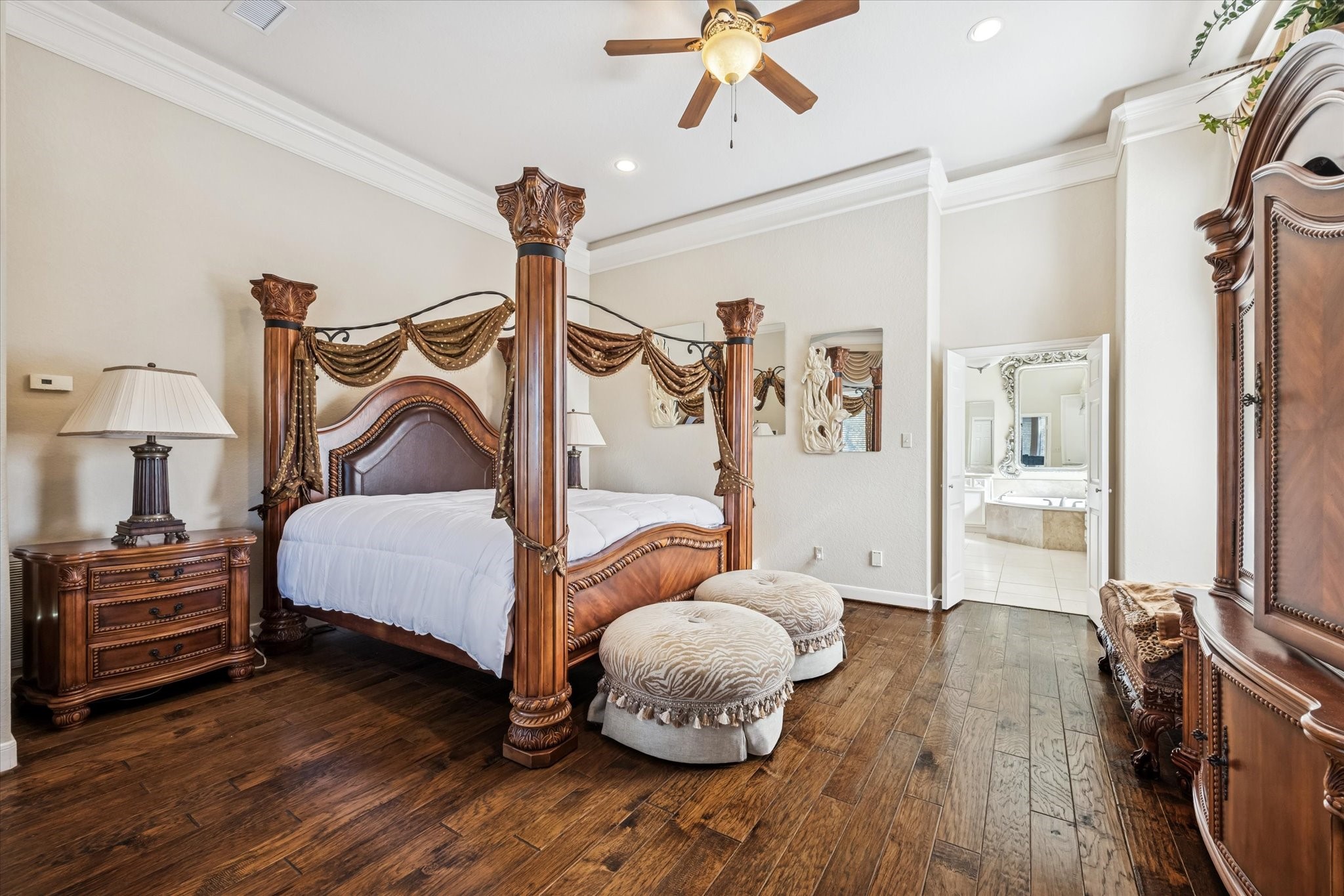 16372 Highway 6 Navasota, TX 77868 - Photo 22 of 49 a bedroom with a bed and wooden floor