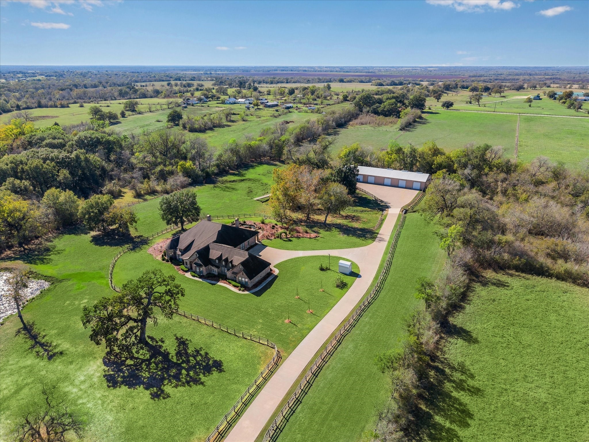16372 Highway 6 Navasota, TX 77868 - Photo 4 of 49 an aerial view of a golf course with a lake view