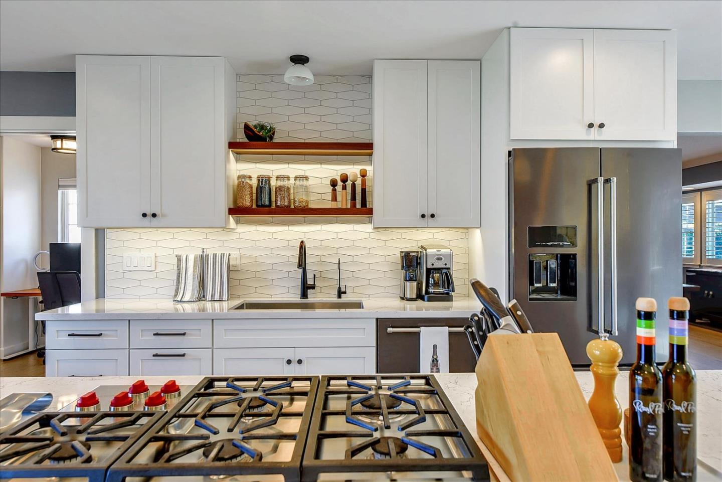 1712 St Anthony Drive San Jose, CA 95125 - Photo 11 of 47 a kitchen with a sink stove and cabinets