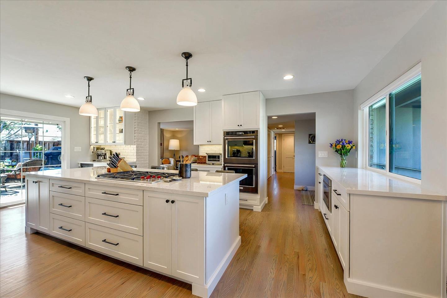 1712 St Anthony Drive San Jose, CA 95125 - Photo 15 of 47 a large kitchen with stainless steel appliances kitchen island granite countertop a large counter top and sink