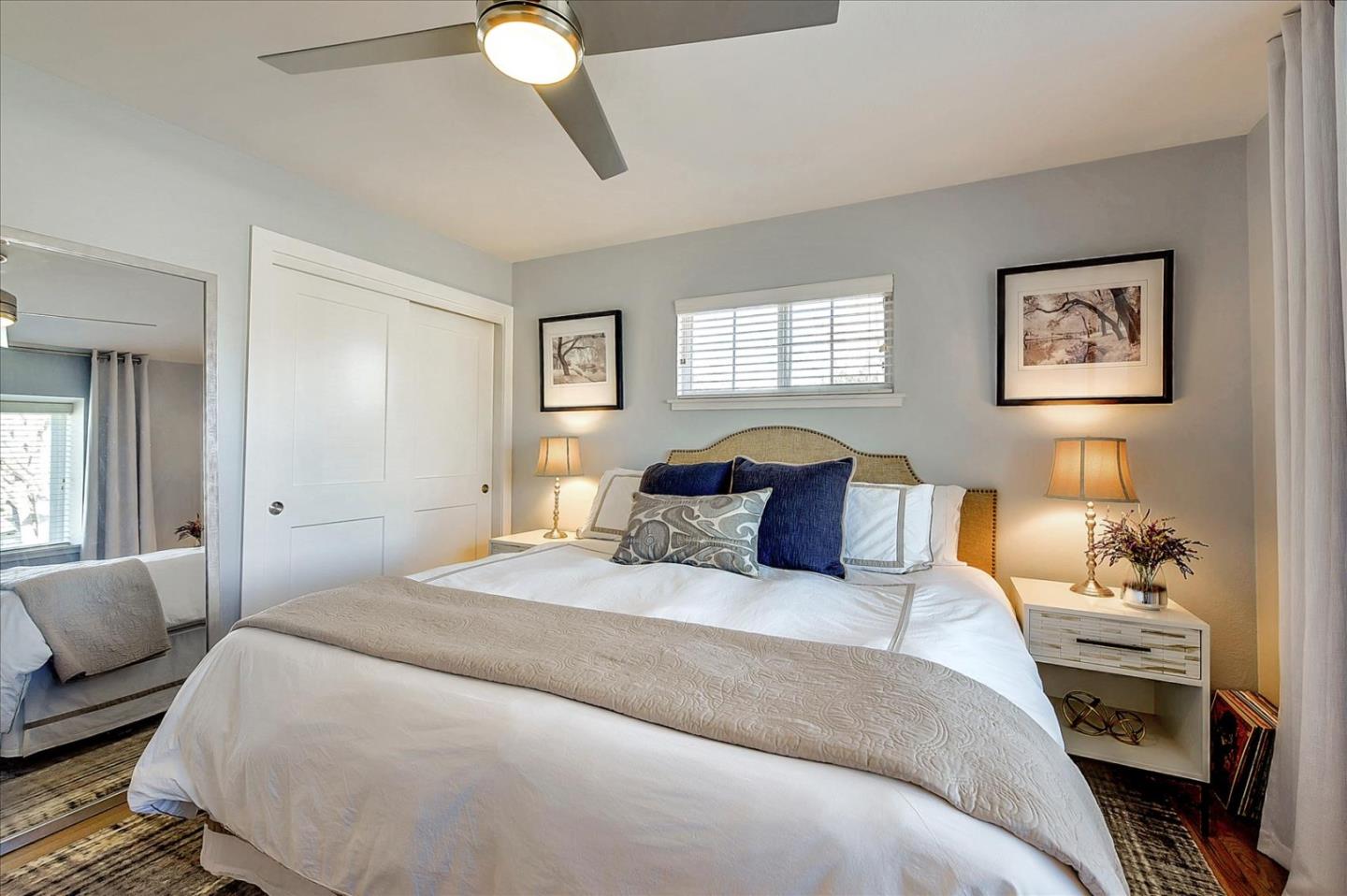 1712 St Anthony Drive San Jose, CA 95125 - Photo 29 of 47 a bedroom with a bed and a chandelier