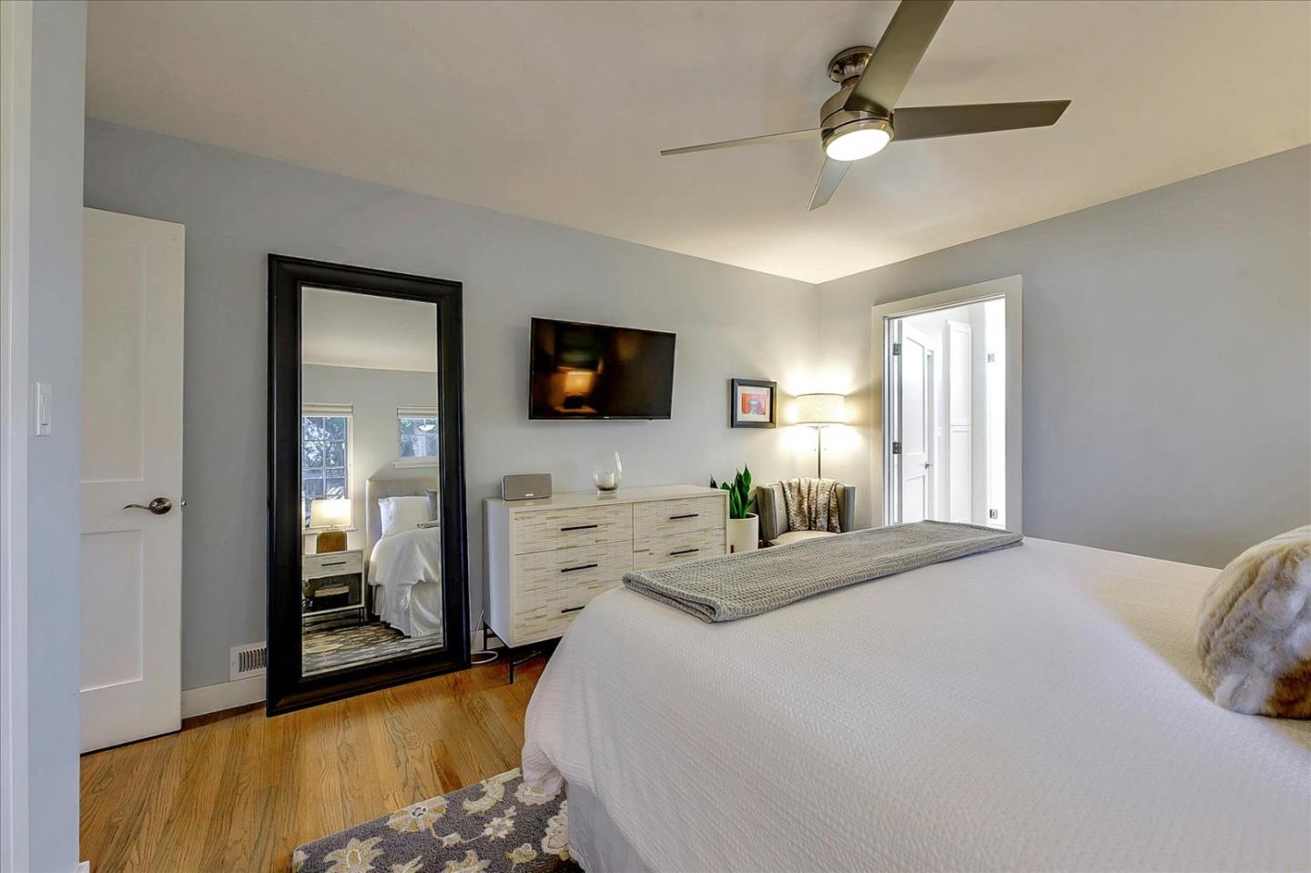 1712 St Anthony Drive San Jose, CA 95125 - Photo 34 of 47 a bedroom with a bed and a flat tv screen on dresser