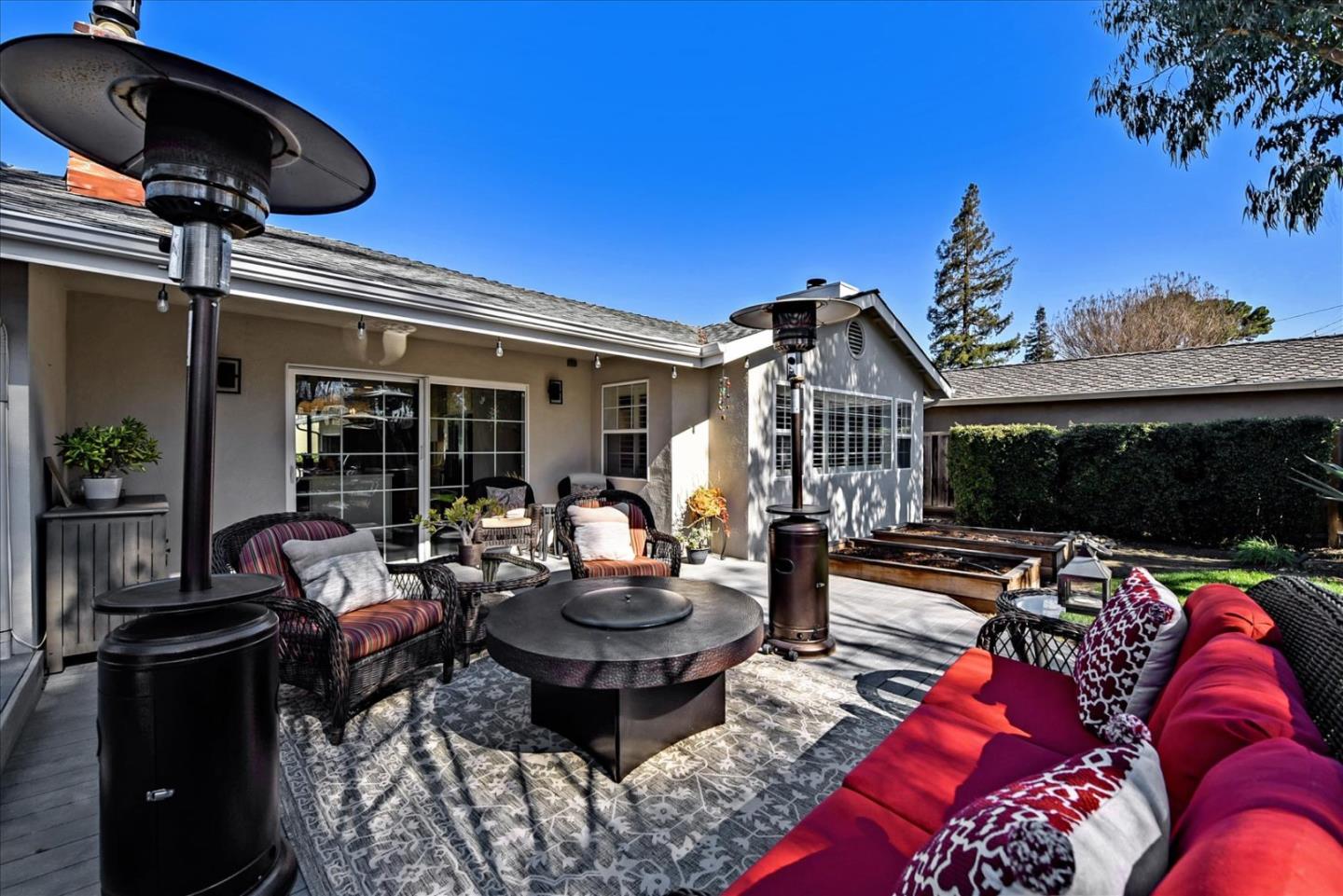 1712 St Anthony Drive San Jose, CA 95125 - Photo 44 of 47 a view of a patio with table and chairs potted plants and a large tree