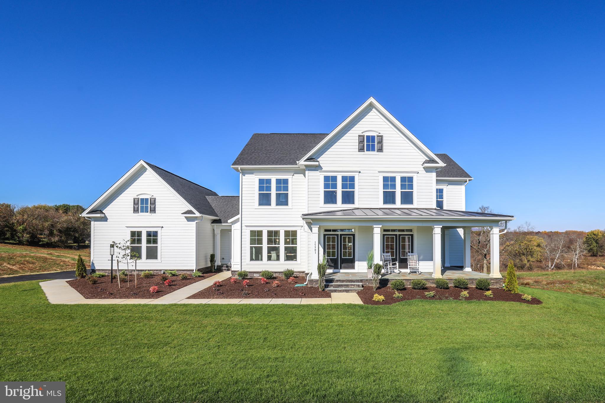 17628 Bates Drive Hamilton, VA 20158 - Photo 1 of 57 a front view of a house with a yard