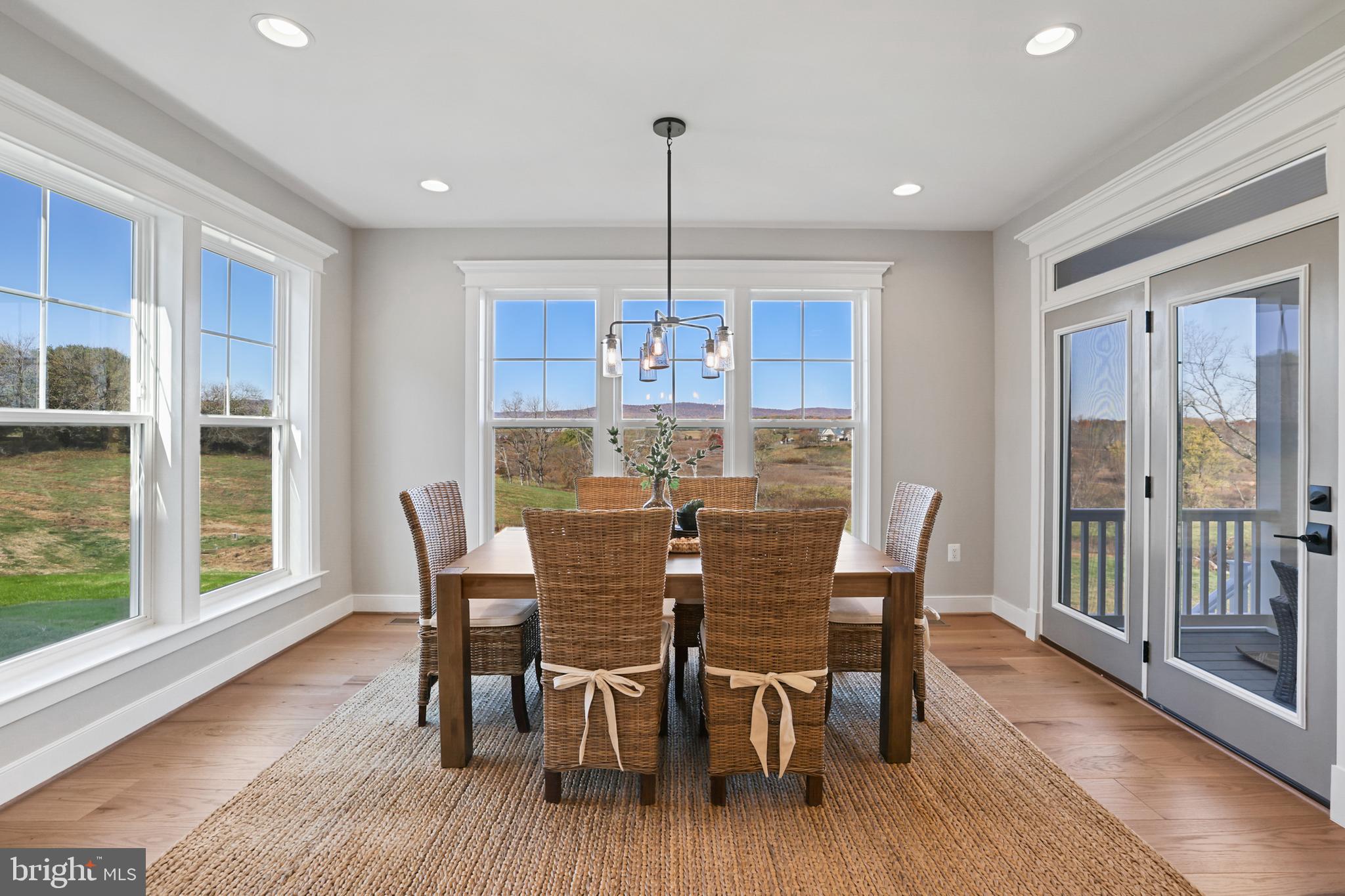 17628 Bates Drive Hamilton, VA 20158 - Photo 11 of 57 a view of a dining room with furniture window and wooden floor