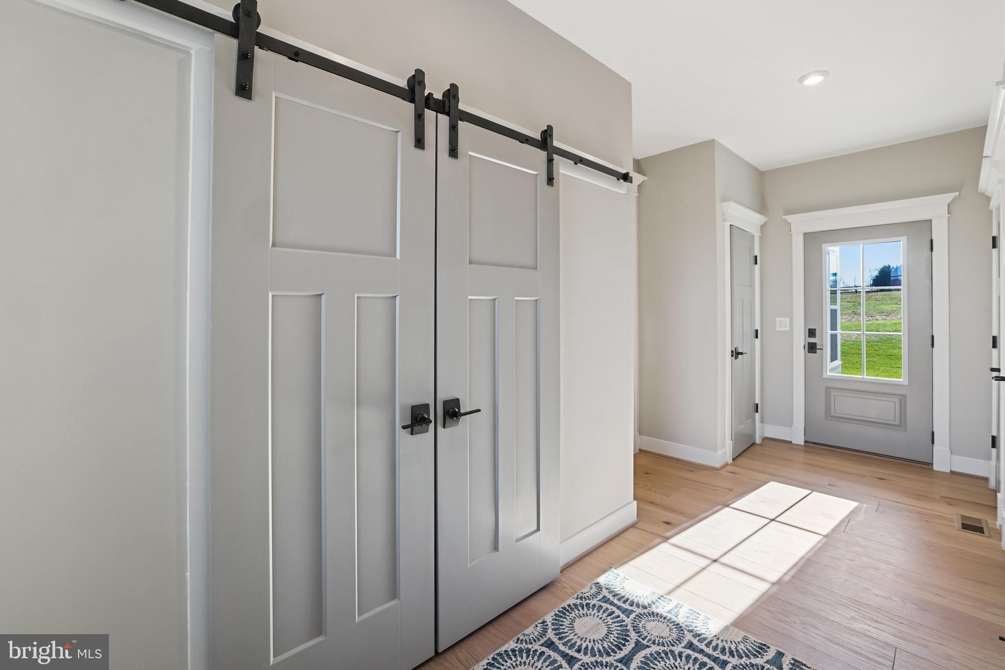 17628 Bates Drive Hamilton, VA 20158 - Photo 2 of 57 a view of entryway with wooden floor and mirror