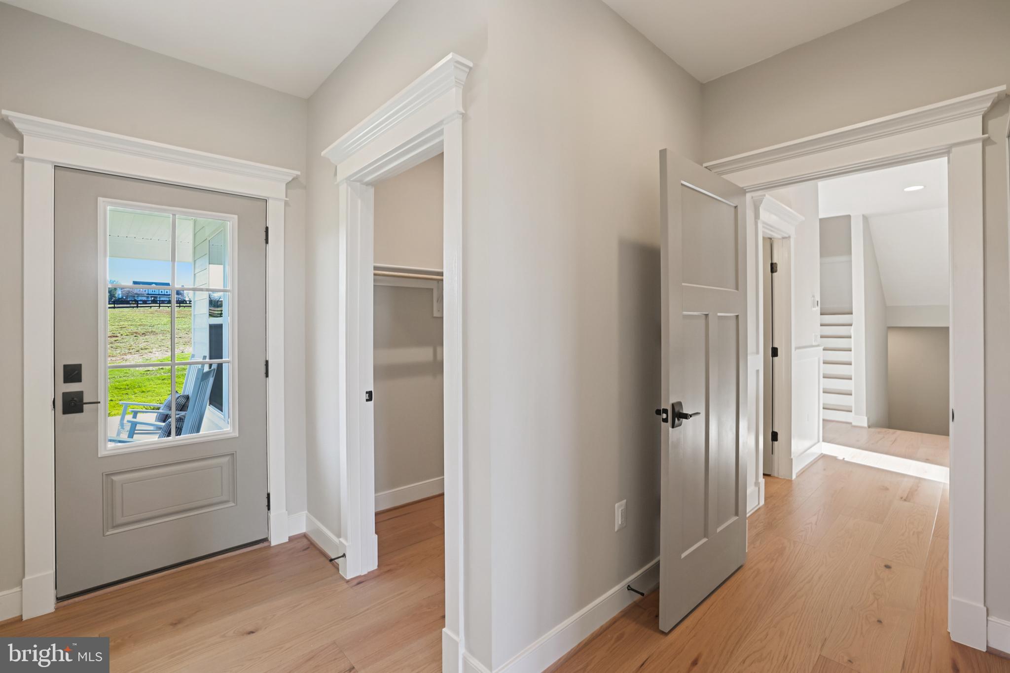 17628 Bates Drive Hamilton, VA 20158 - Photo 21 of 57 a view of a hallway with wooden floor and a living room