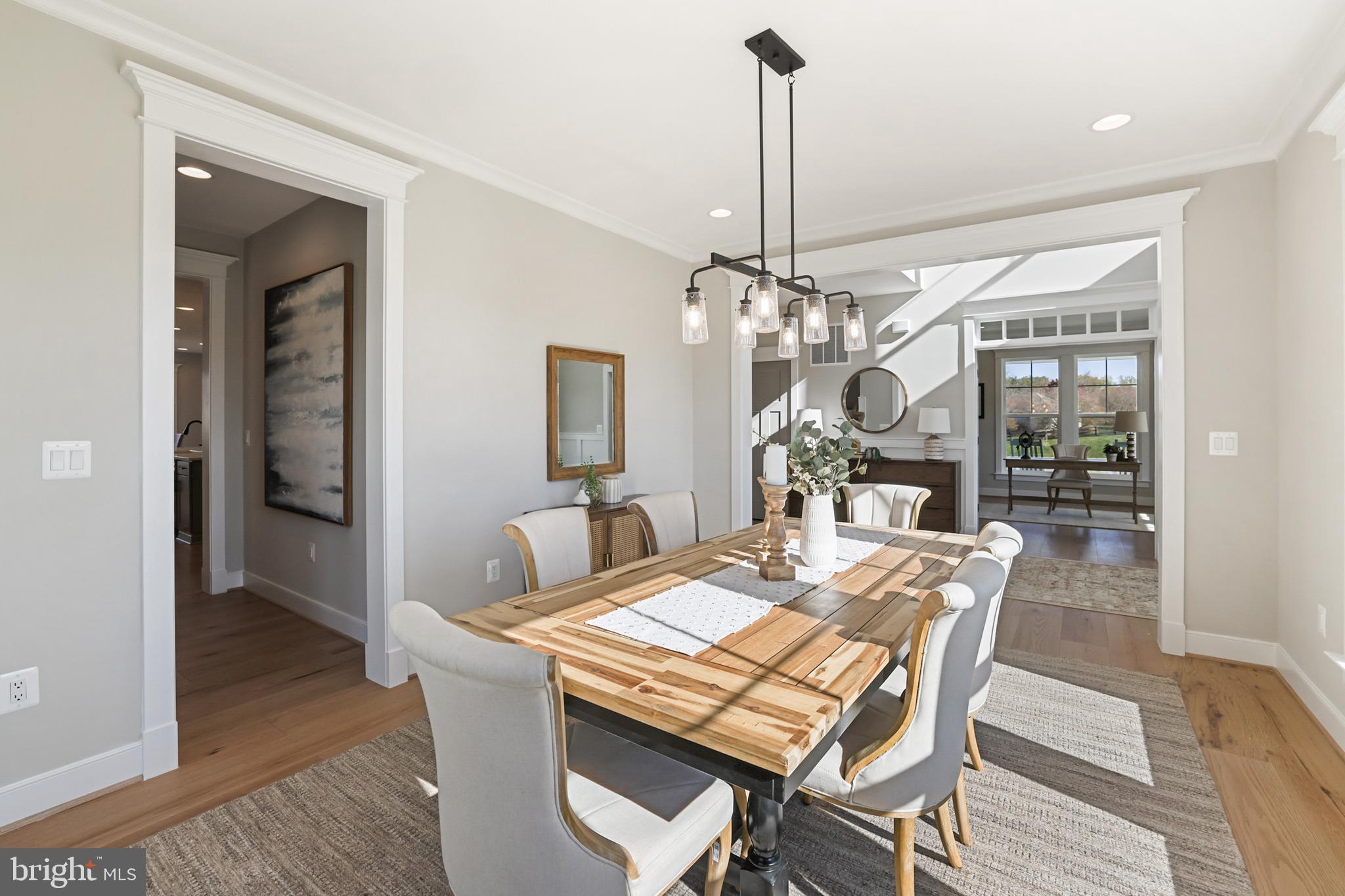 17628 Bates Drive Hamilton, VA 20158 - Photo 25 of 57 a view of a dining room with furniture wooden floor and chandelier