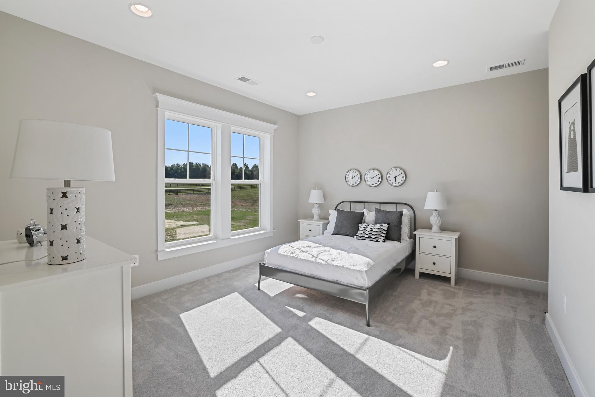 17628 Bates Drive Hamilton, VA 20158 - Photo 39 of 57 a bedroom with a bed table and window