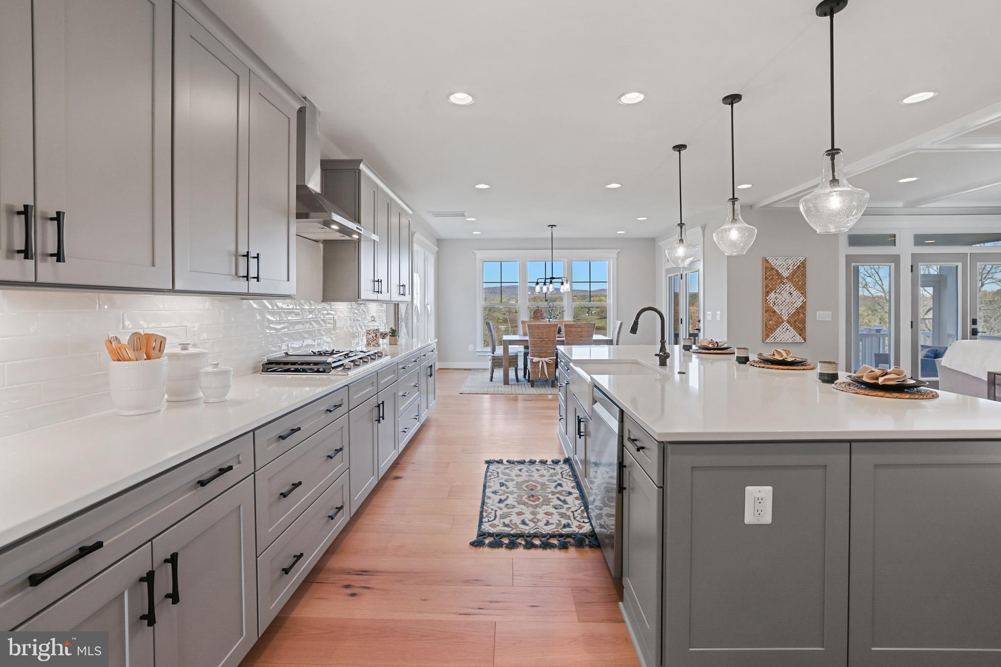 17628 Bates Drive Hamilton, VA 20158 - Photo 5 of 57 a kitchen with counter top space a sink stainless steel appliances and cabinets