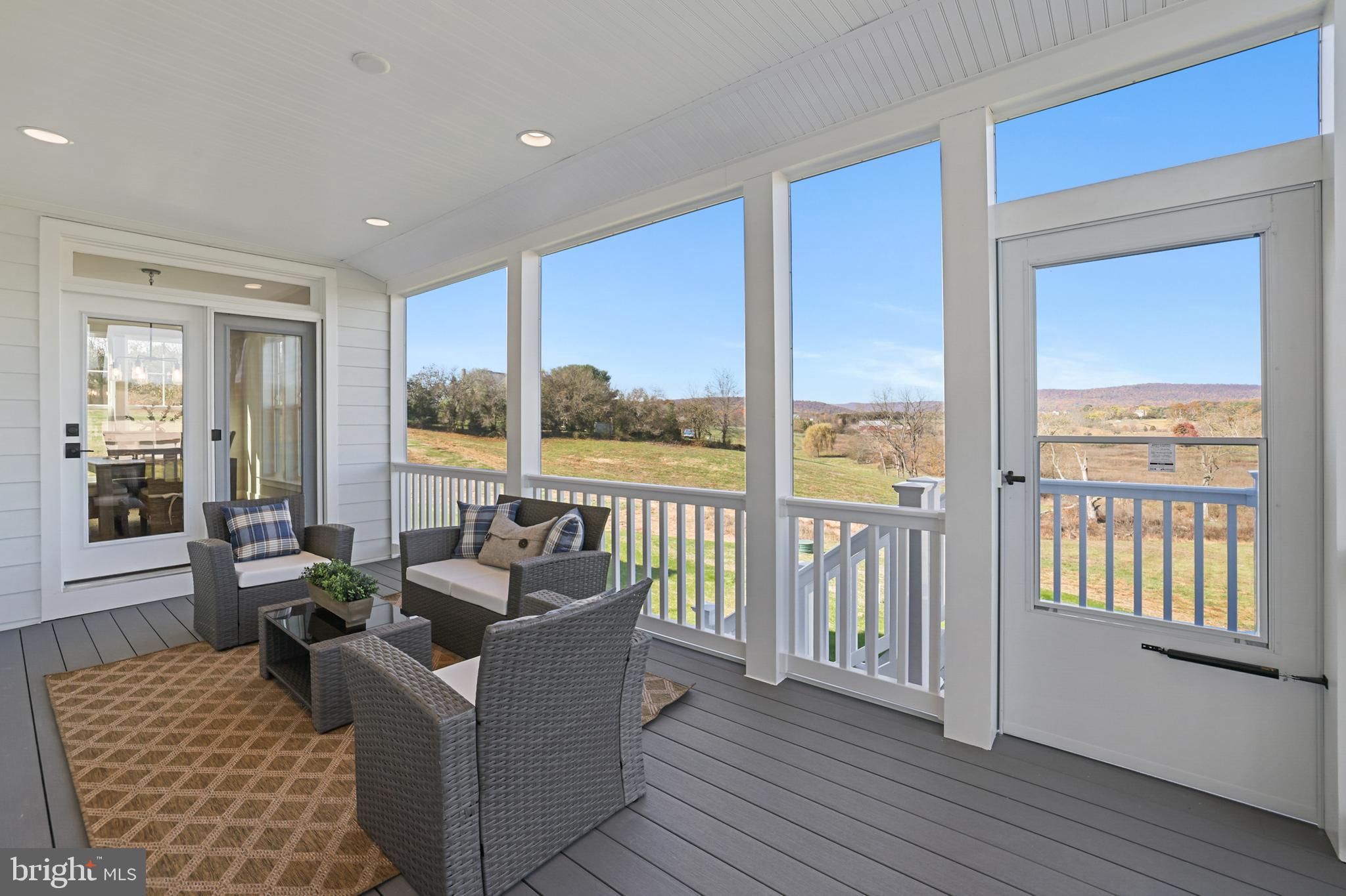 17628 Bates Drive Hamilton, VA 20158 - Photo 55 of 57 a living room with furniture and floor to ceiling windows