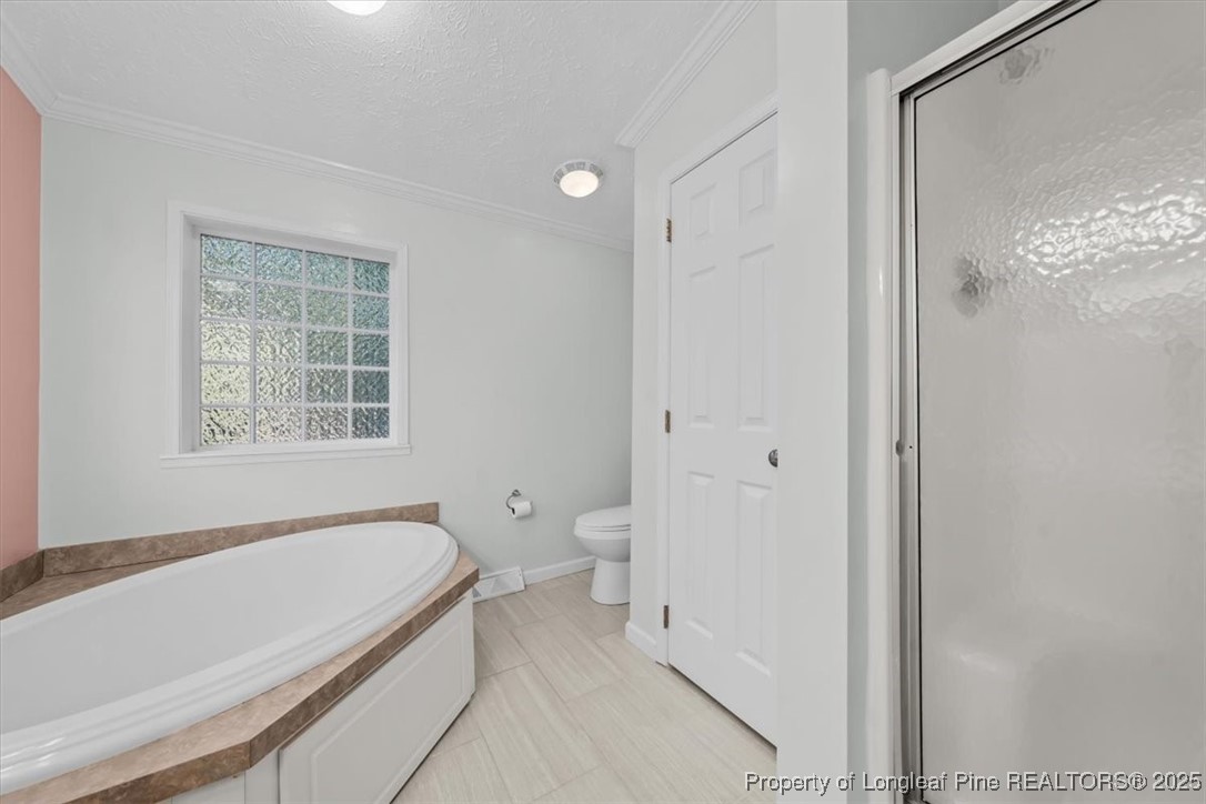 11891 Aberdeen Road Aberdeen, NC 28315 - Photo 14 of 35 a spacious bathroom with a granite countertop tub shower and a sink
