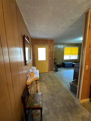 a kitchen with stainless steel appliances granite countertop a stove refrigerator and cabinets