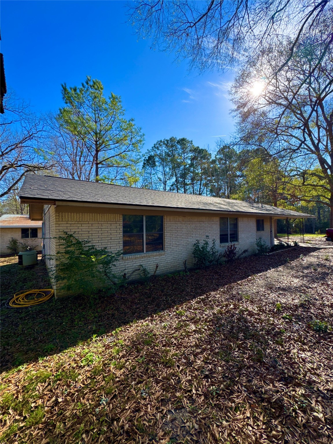 263 County Road 355 Jasper, TX 75951 - Photo 3 of 45 a front view of a house with garden