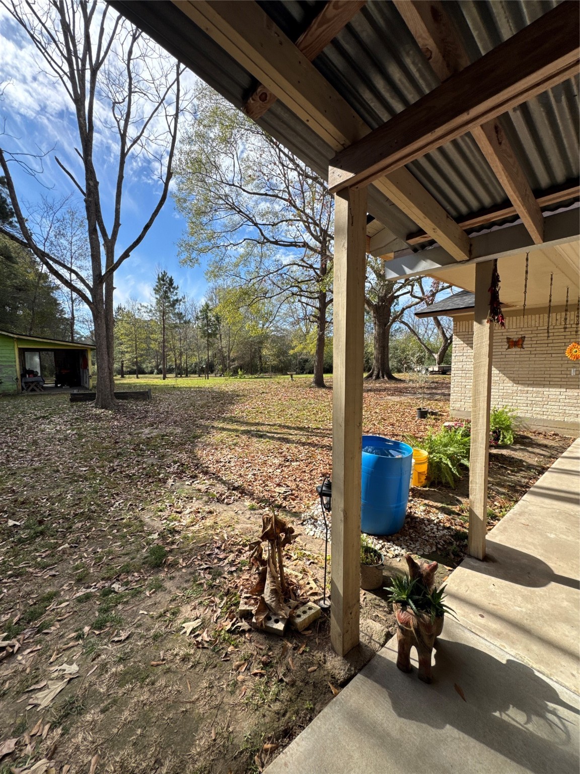 263 County Road 355 Jasper, TX 75951 - Photo 39 of 45 a view of a porch with furniture and a yard