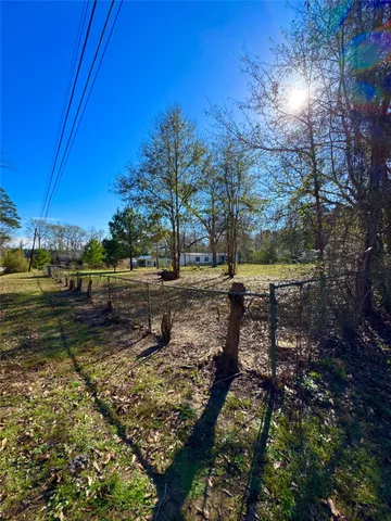 a view of a yard with trees