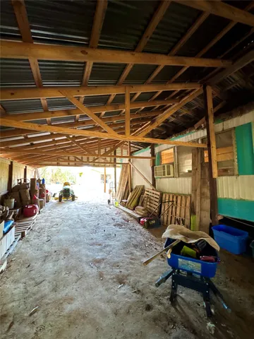 a view of a backyard with large trees