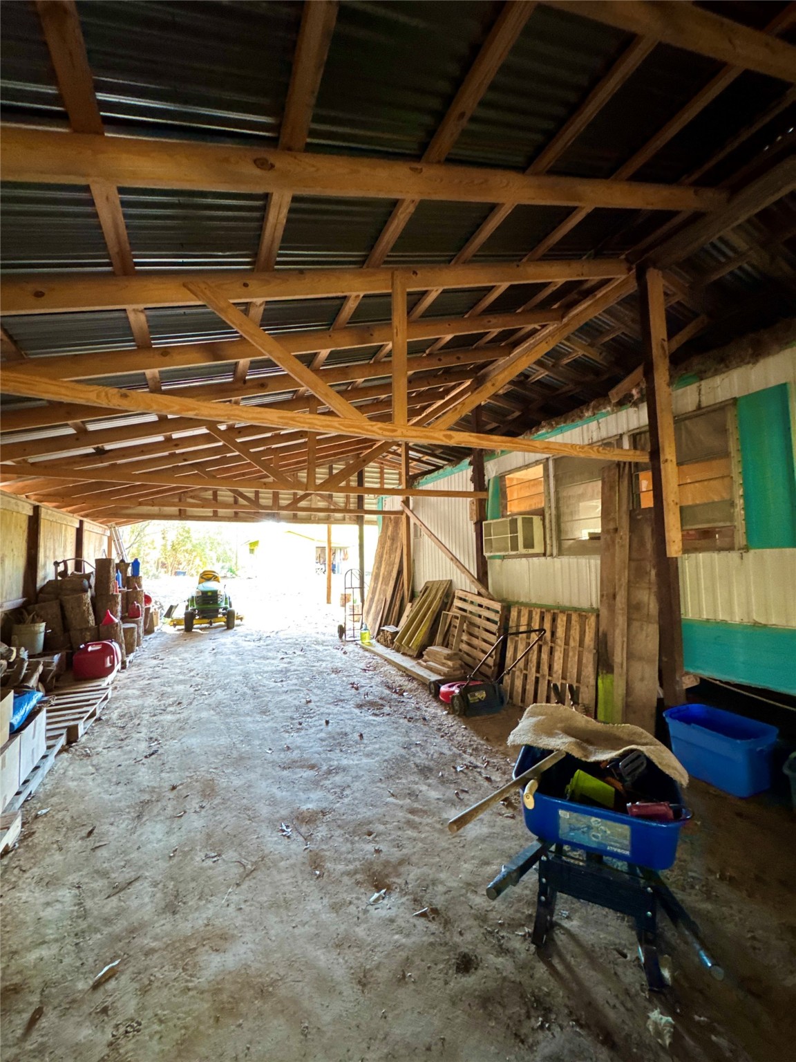 263 County Road 355 Jasper, TX 75951 - Photo 8 of 45 a backyard of a house with outdoor seating