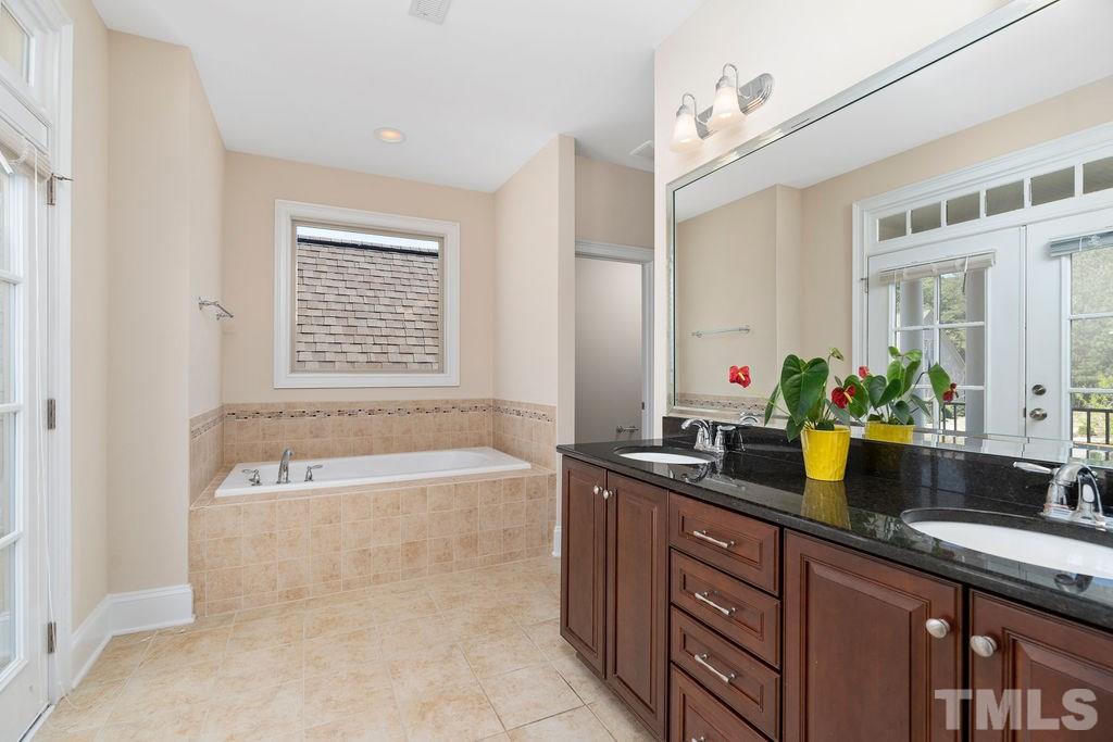 3322 Roller Mill Court Raleigh, NC 27607 - Photo 24 of 30 French doors to private balcony/soaking tub/double vanities