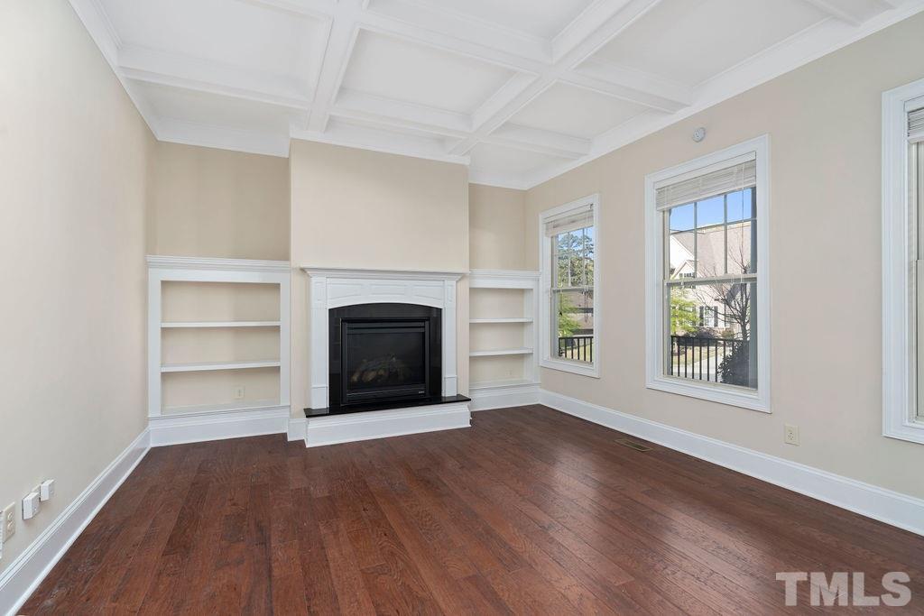 3322 Roller Mill Court Raleigh, NC 27607 - Photo 6 of 30 custom bookshelves/gas fireplace/coffered ceilings