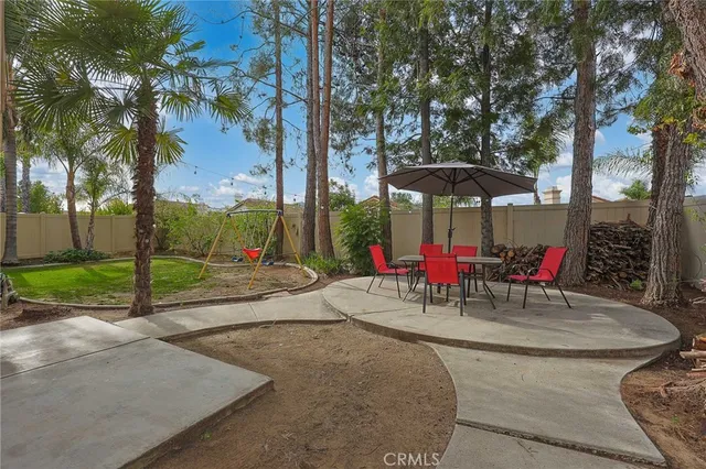 an outdoor space with patio and white umbrellas