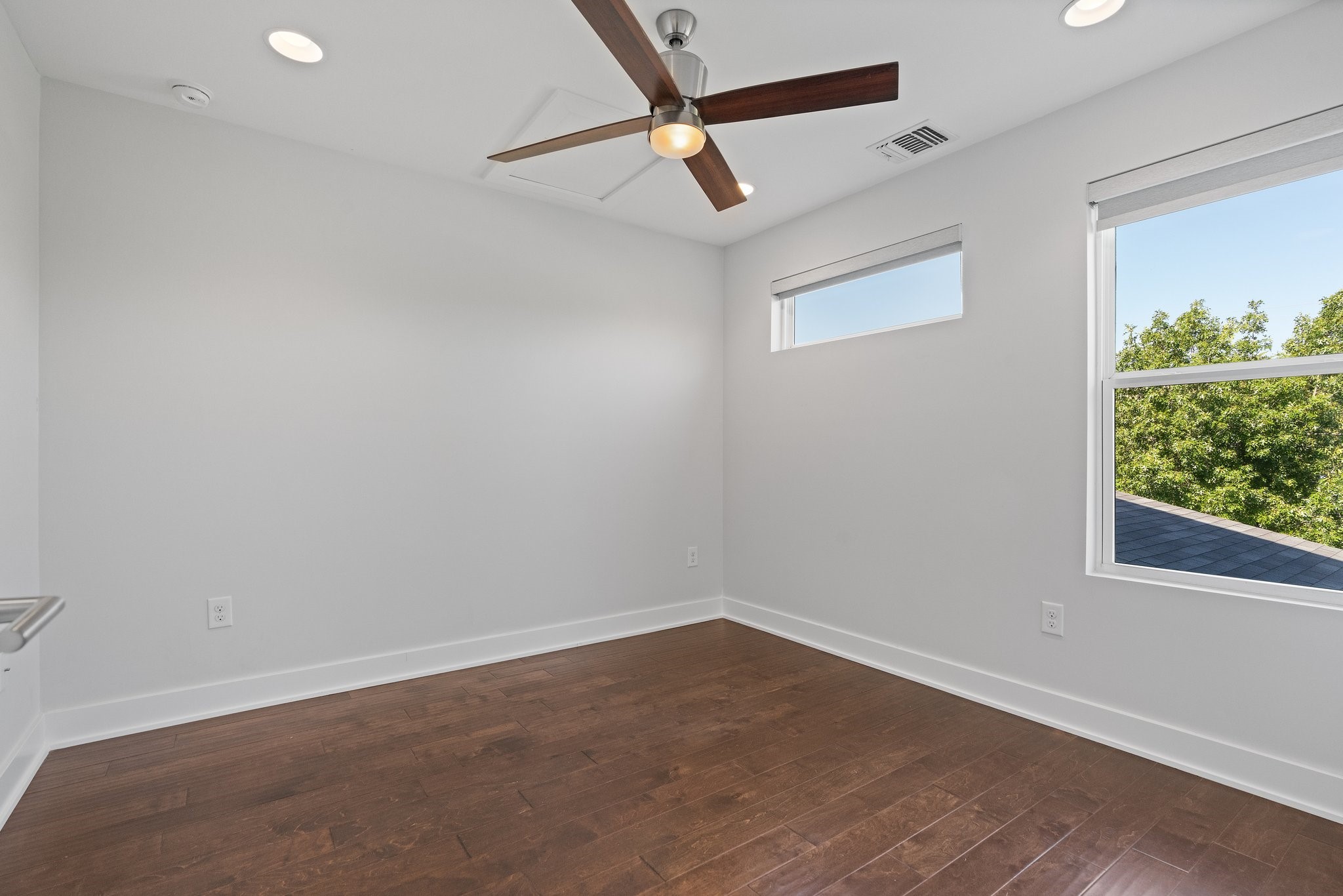 7217 Blessing Avenue, Unit A Austin, TX 78752 - Photo 14 of 22 2nd & 3rd Bedrooms with hardwood floors, great lighting and modern ceiling fans.