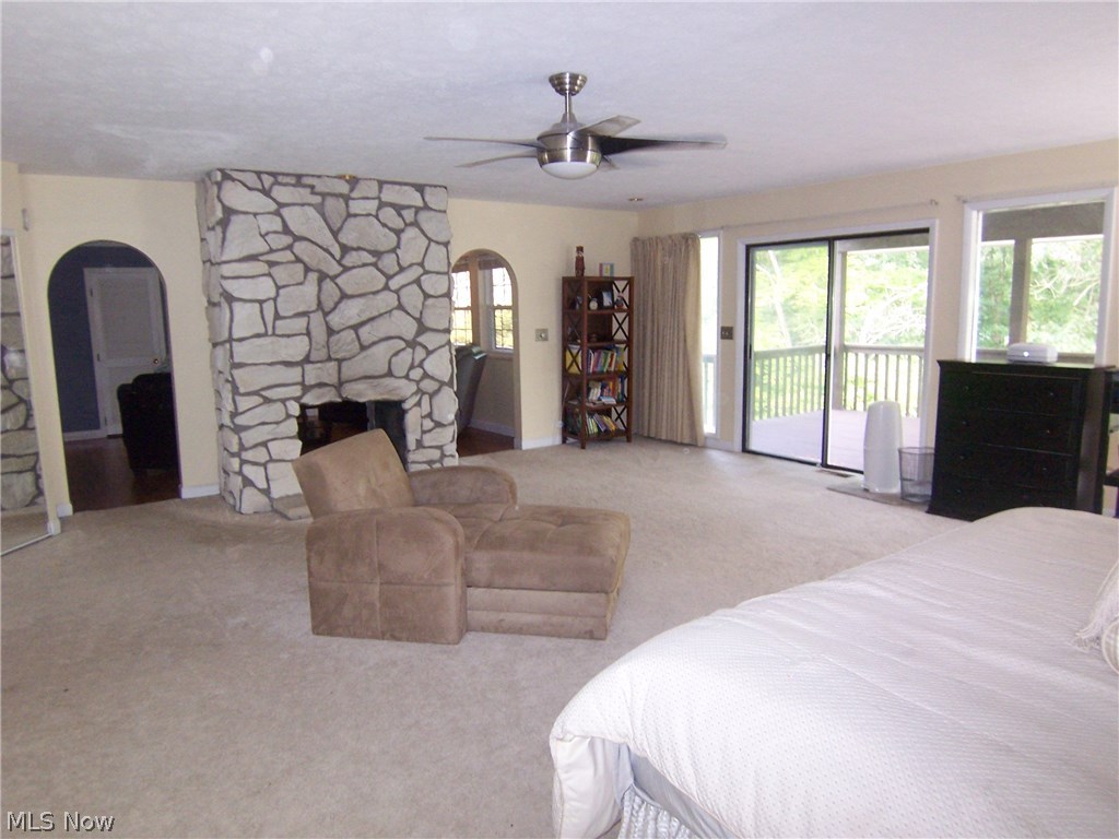 122 Rector Road Parkersburg, WV 26104 - Photo 13 of 35 Oh what a master bedroom suite. This bedroom is 23 x 23 with a gas fireplace, sitting room and bath. Notice the private deck overlooking the wooded lot.