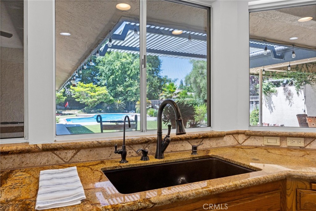 11717 Old Town Road Bakersfield, CA 93312 - Photo 30 of 61 a kitchen with a sink and large window