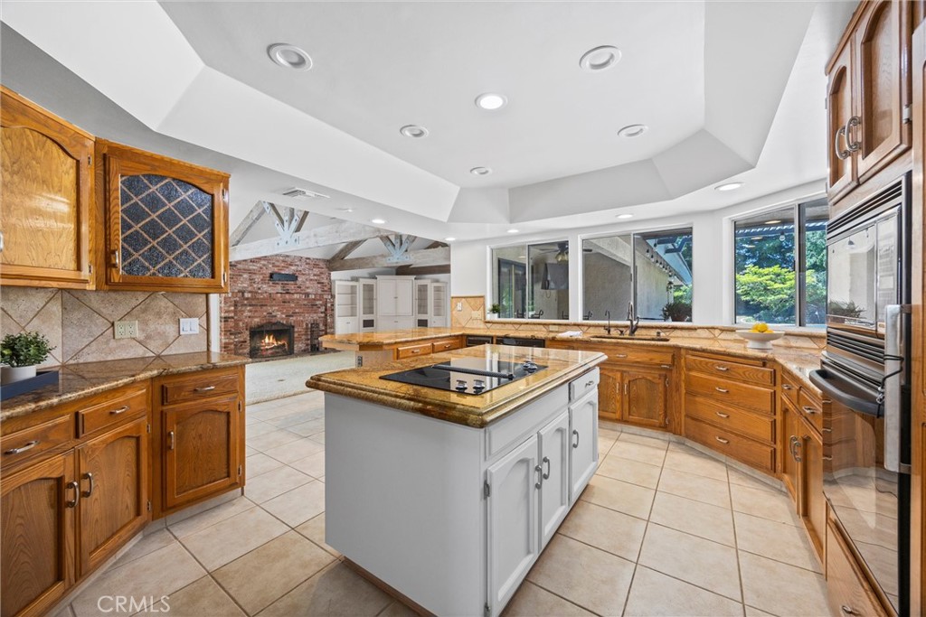 11717 Old Town Road Bakersfield, CA 93312 - Photo 31 of 61 a kitchen with stainless steel appliances granite countertop a stove and a sink