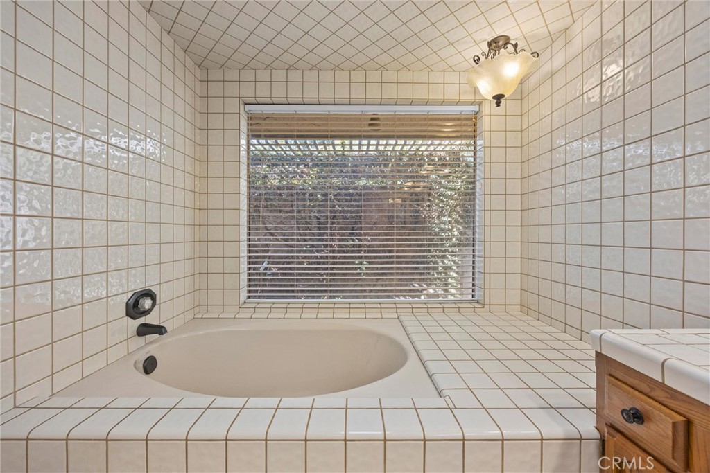 11717 Old Town Road Bakersfield, CA 93312 - Photo 37 of 61 a bathroom with a bathtub and shower