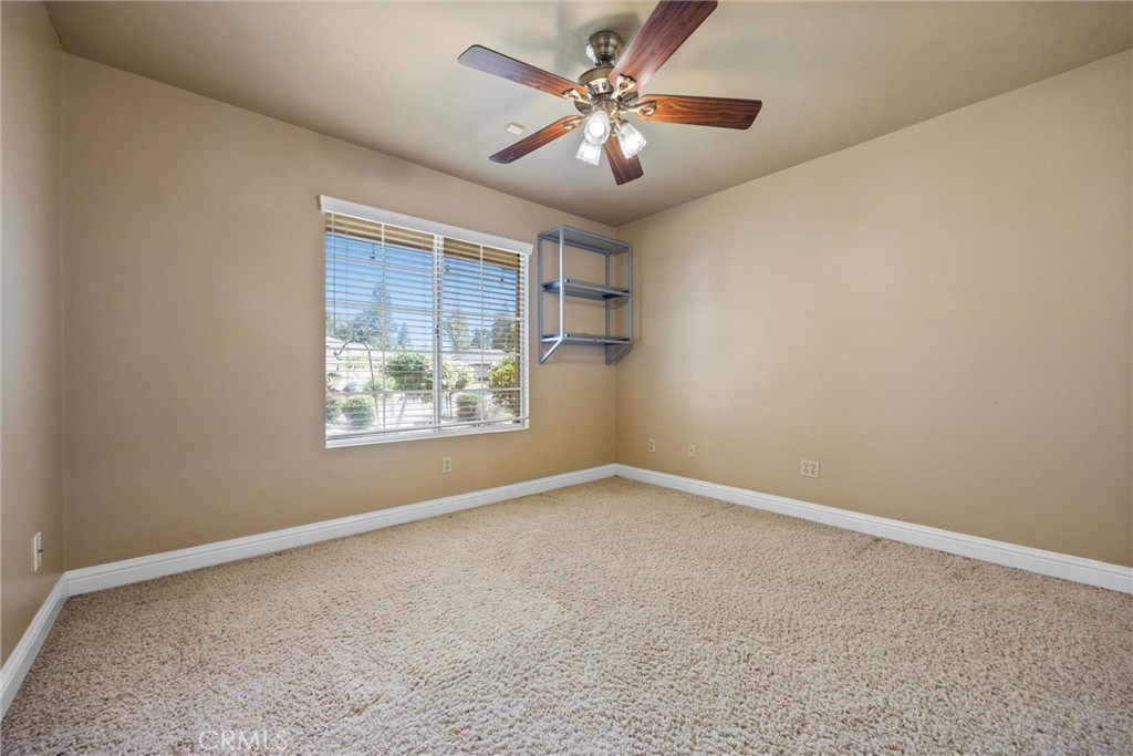 11717 Old Town Road Bakersfield, CA 93312 - Photo 46 of 61 an empty room with a window and a fan