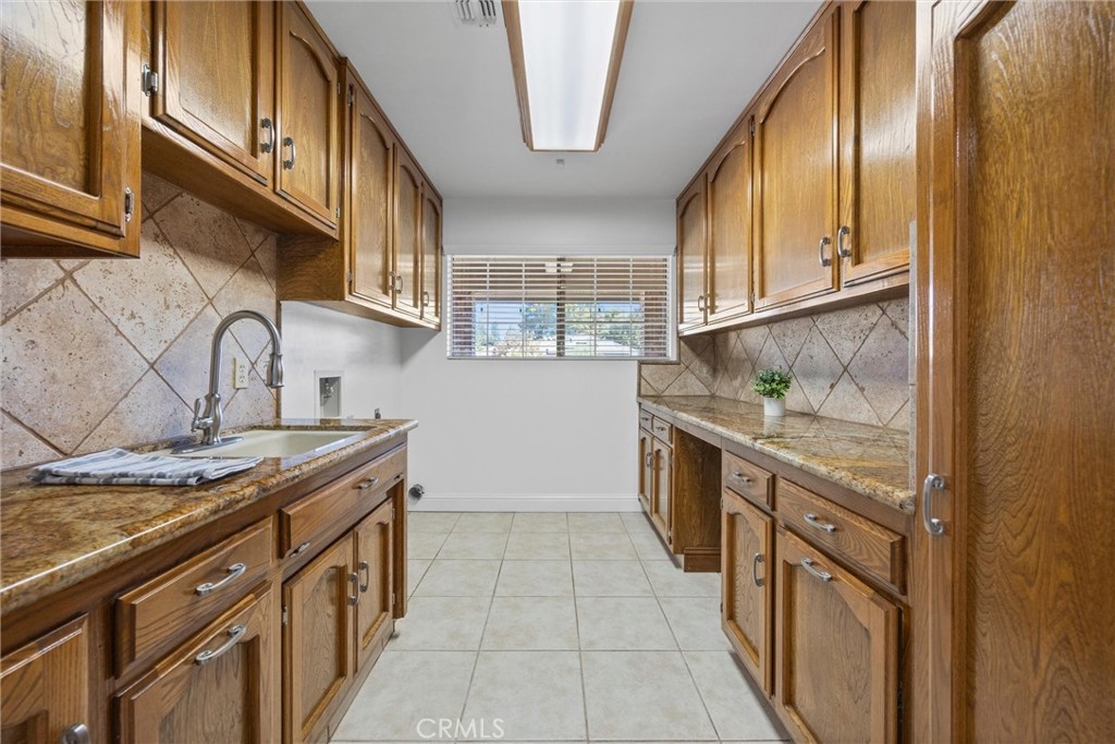 11717 Old Town Road Bakersfield, CA 93312 - Photo 48 of 61 a kitchen with stainless steel appliances granite countertop a sink and a stove
